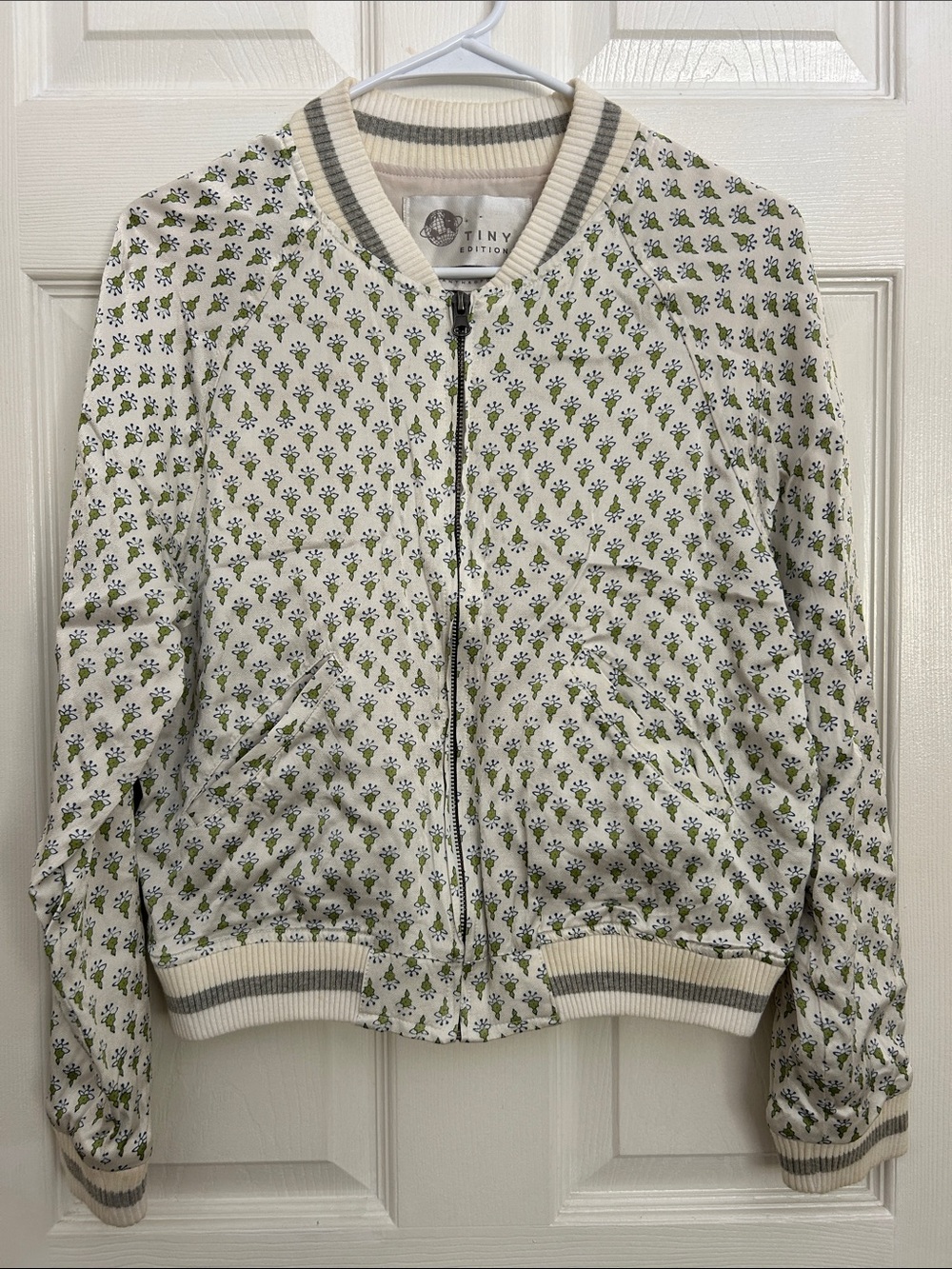 Anthropologie Cream Bomber Jacket with Olive Motif